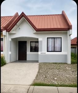 a rendering of a house with a red roof at Welcome Home, whole 2 bedroom unit - VCDU Riverview, Mabini Plains in Mabini