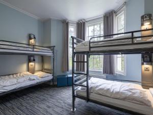 a room with three bunk beds in it at YHA Stratford-Upon-Avon in Stratford-upon-Avon +64 photos