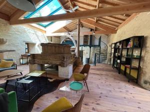 a large room with a large organ in a building at Le Moulin de Tiquetorte in Moulis-en-Médoc