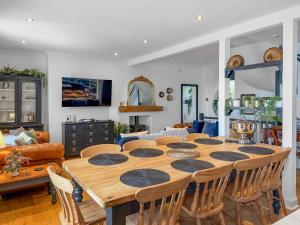 a dining room with a table and chairs at Nautilus Cottage in Cellardyke