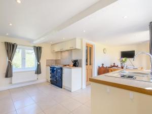 a kitchen with a sink and a counter at Rathlin Cottage in Cambridge