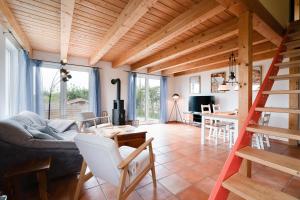 a living room with a couch and a table at Atempause in Fehmarn