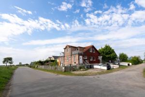 a house sitting on the side of a road at Atempause in Fehmarn