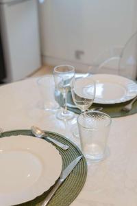 a table with plates and wine glasses on it at l'Onyx in La Rochelle +7 photos
