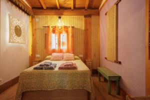 a bedroom with a bed in a room at El Grifo Casa De Campo Con Piscina in Carmona +19 photos
