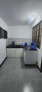 a kitchen with a counter and a sink in a room at Stay at Amazing Grace, whole unit- VCDU subdivision , Mabini Plains in Mabini