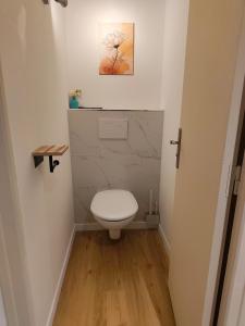 a bathroom with a toilet and a picture on the wall at Bonlogem - Air-conditioned apartment Sainte Claire in Pertuis +18 photos