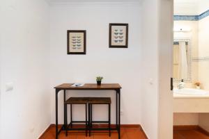 a small table in a bathroom with a sink at Quinta da Torre in Torre +91 photos