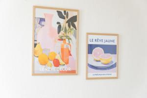two framed pictures of fruit and a vase on a wall at KasselRooms Design Studio in Kassel +78 photos