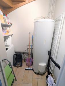 a room with a refrigerator and a water heater at Gite Entre Pierre et Come in Chablis +18 photos