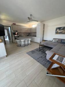 a living room with a couch and a table at La casa di Gio' Lake Maggiore Near Leonardo in Dormelletto +145 photos