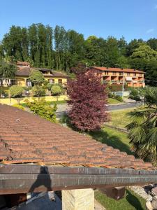 a view of a house with a tiled roof at La casa di Gio' Lake Maggiore Near Leonardo in Dormelletto