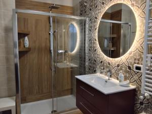 a bathroom with a shower and a sink and a mirror at B&B Galleria 37 in Canosa Sannita +29 photos