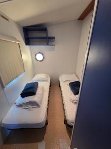 a small room with two bunk beds in it at L évasion in Saint-Thomas-en-Royans