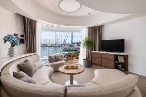 a living room with a couch and a tv at Luxury Floating Apartment - Amor in Split