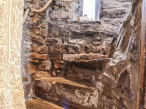 an old stone stairway in a stone building at Ty Fferm Hen - Uk36420 in Talybont
