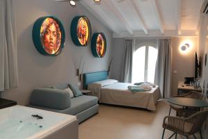 a living room with a couch and a bed at Villa Helena in Limone sul Garda +108 photos