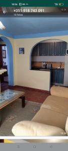 a living room with a couch and a table at Sunshines on the sea in Almuñécar +14 photos