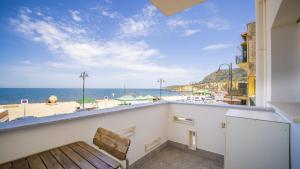 a balcony with a view of the beach at Solemar Sicilia - Casa Bella in Bagheria