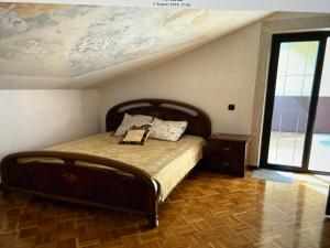 a bedroom with a bed with a book on it at Villa Maya in Portorož