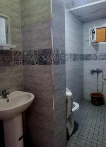 a bathroom with a sink and a toilet at Casa ahlam in Chefchaouen +78 photos