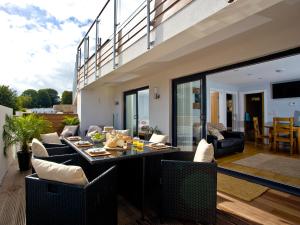 a living room with a table and chairs at Dunlin 1 - The Cove in Brixham