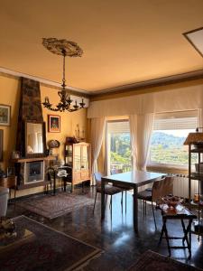 a living room with a table and a fireplace at B&b Golfo dei Poeti in Lerici