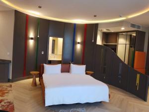 a bedroom with a large white bed in a room at Gorgora Eco Resort in Gorgora