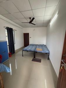 a room with a table in the middle of it at Mousumi Lodge in Tezpur +20 photos