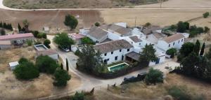 an aerial view of a large white house at Casa Rural La Saucedilla in Archidona