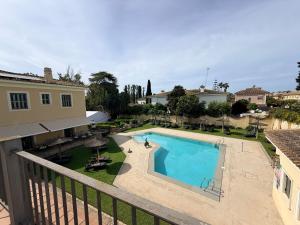 a view of a swimming pool from a balcony at Villa Jerez in Jerez de la Frontera