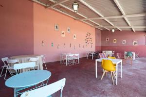 a room with tables and chairs in a room at Quinta da Torre in Torre