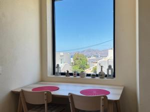 a window in a room with a table and two chairs at Casa Solano in Tías