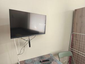 a flat screen tv hanging on a wall at Apartment in the Center 2 in Varna City