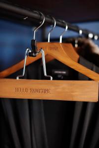 a wooden hanger with the words hello homophone on it at Hotel Covington Cincinnati Riverfront in Covington