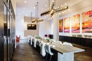 a long dining room with a long table at Hotel Covington Cincinnati Riverfront in Covington