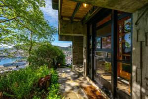 a house with a view of a city at Skyline View - Nordic Villa Above Bergen in Bergen