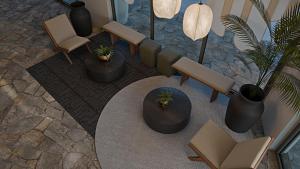 an overhead view of a lobby with chairs and a table at Grecale Filoxenia in Vrachonisída touArchangélou