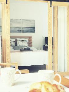 a bedroom with a bed and a table with food at Nowy dom przy starym krześle - w Pelniku in Pelnik