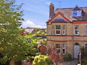 a brick house with a chimney on top of it at The Forest- Silverwood in Cambridge