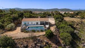 an aerial view of a house with a swimming pool at Villa Belchior by Algarve Holidays in Faro