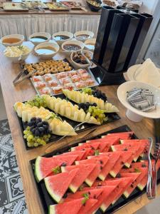 a table topped with lots of different types of fruit at Kirykos Otel in Gökçeada