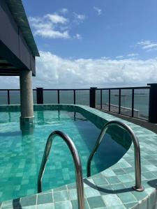 a swimming pool on the roof of a building at Hotel Brasil Tropical in Fortaleza