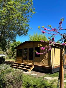 a large tent in a yard with trees at Camping Onlycamp les Cochards in Seigy +6 photos