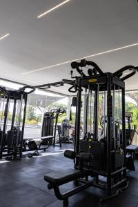 a gym with several treadmills and machines at Vale Do Lobo Resort in Vale do Lobo