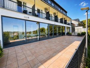 an empty courtyard of a building with large windows at Elion Hotel Siegen in Siegen