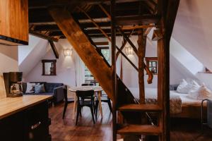 a room with a bunk bed and a dining room at Wysoka 5 in Szklarska Poręba