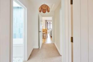 a hallway leading to a living room with a hallway at Host & Stay - Puffin Cove in Seahouses