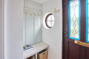 a bathroom with a sink and a mirror at Host & Stay - Puffin Cove in Seahouses +16 photos