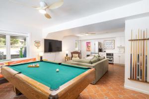 a living room with a pool table at Pool & Spa Game Rm Walking Distance to Beach & Shops in Duck
